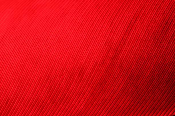 A crumpled red fabric background. Close up.