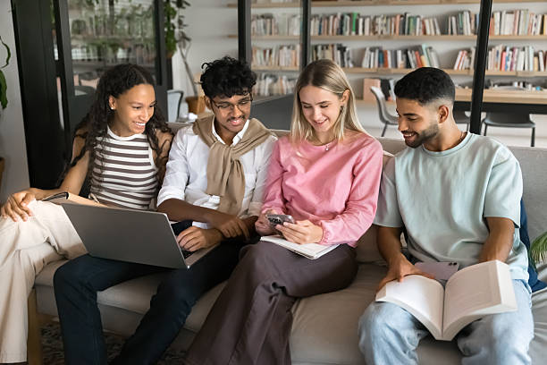 istock Multiethnic team of student friends discussing online learning content 2209760570