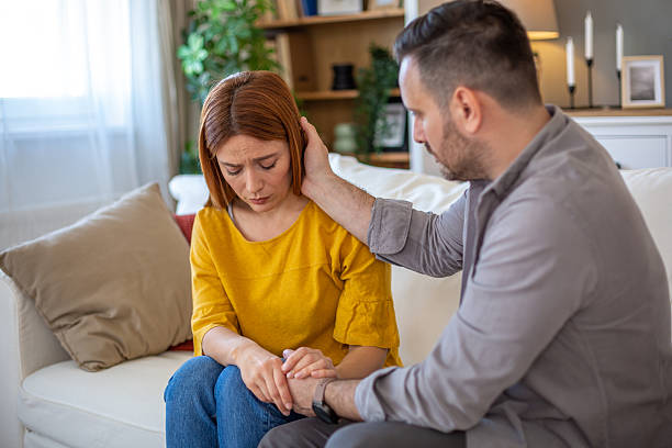 istock Man comforting his sad wife 2209761794