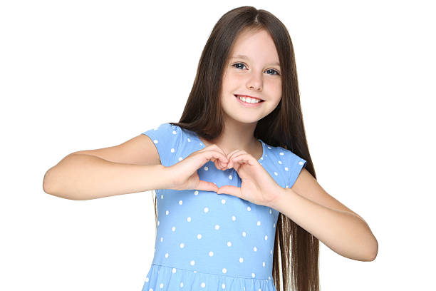 istock Young girl showing heart by hands on white background 2209763638