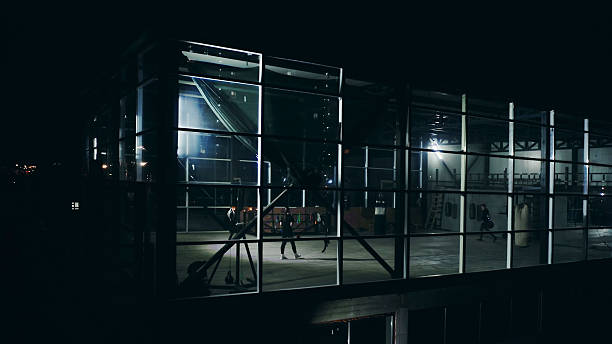 istock Athletes training at night in a modern gym with glass walls 2209766576