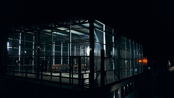 istock Athletes training at night in a modern gym with glass walls 2209766602