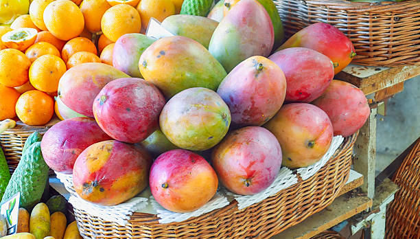 Mango in wicker basket on fresh fruit market. Madeira, Portugal.