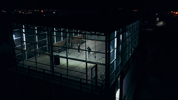 istock Two athletes training at night in a modern gym with glass walls 2209770549