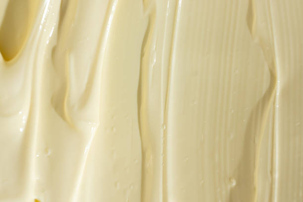 istock Glossy White Mayonnaise Surface. Food Texture Background 2209770912