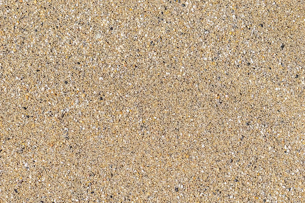istock Close-up image of golden beach sand mixed with small pebbles 2209771562