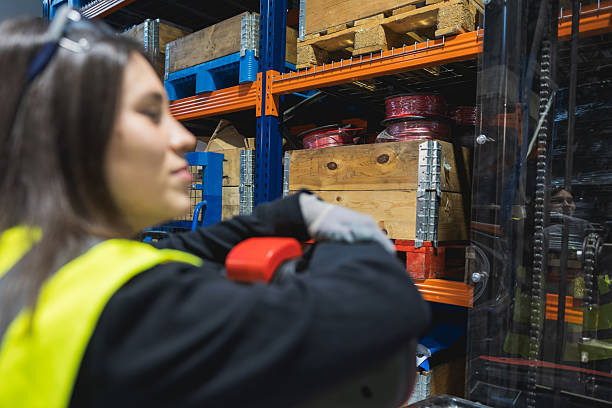 istock Warehouse worker moving goods with forklift in logistics center. 2209773292