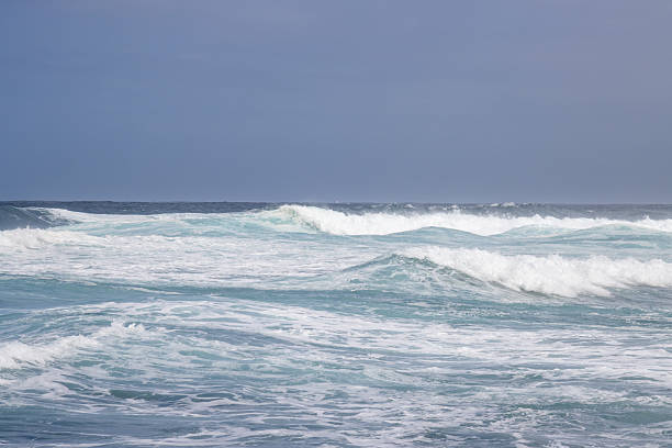 Big powerful storm waves in Porto Moniz, on the Madeira Atlantic coastline and sharp volcanic rocks