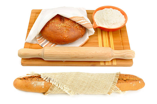 Freshly baked baguette, bread, flour and rolling pin isolated on white background. Collage.