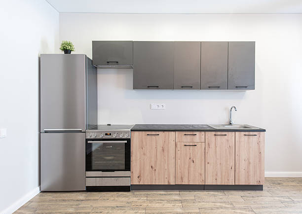 Modern Kitchen Interior with Light Wood Cabinets and Stainless Steel Appliances