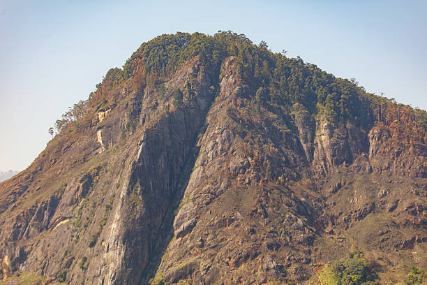 istock A mountain with a rocky peak and a lush green valley below 2209783382