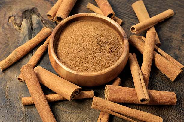 istock cinnamon sticks and cinnamon on the rustic wooden 2209783882