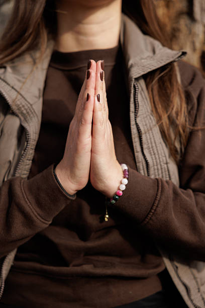 istock Anonymous Woman Meditating by a Tree in a Serene Forest Landscape 2209784655