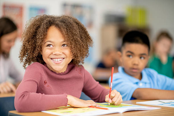 istock Happy School Children Learning Together in a Friendly Classroom Environment 2209787662