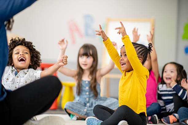 istock Children Sitting on the Floor Participating in a Fun Classroom Activity 2209787680