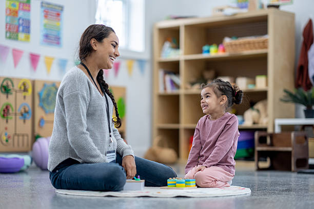 istock Teacher Engaging with Child in Educational Activity at a Preschool Setting 2209788380