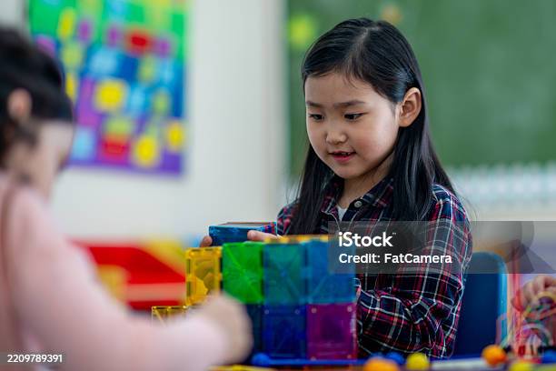 Children Engaging In Learning Children Engaging In Educational Play Activities In A Classroom Setting ...