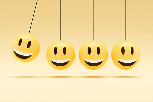 istock Newton’s Cradle with Smiley Face Emoji, Teamwork and Leadership Concept 2209790735