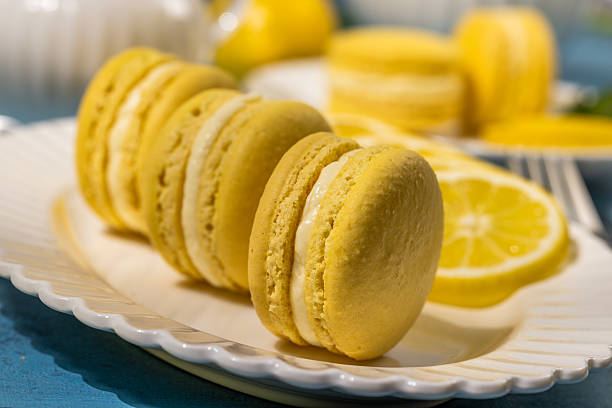 istock Delicious lemon macarons resting on a white plate 2209792705