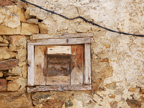 old historical facade of a bulding with abondoned window