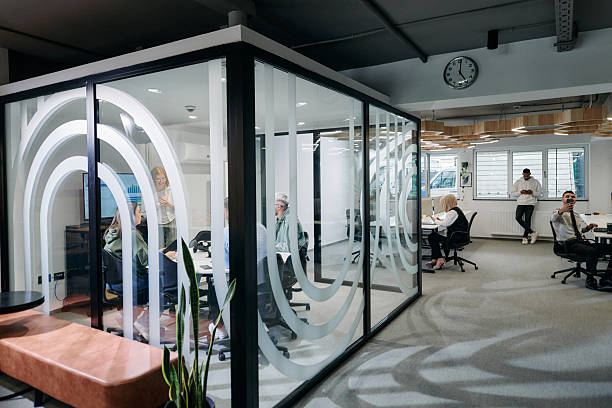 istock A diverse group of businessmen collaborates and tests a new virtual reality technology, wearing virtual glasses, showcasing innovation and creativity in their futuristic workspace 2209805477