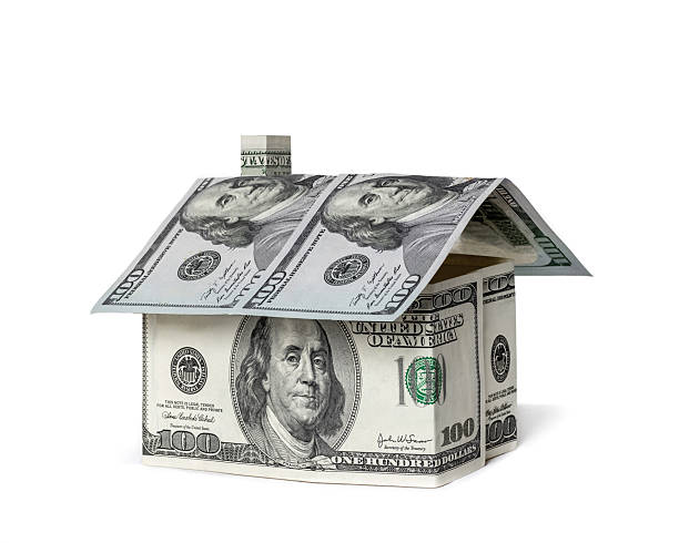istock House Made of Dollar Bills Isolated on White Background 2209806407