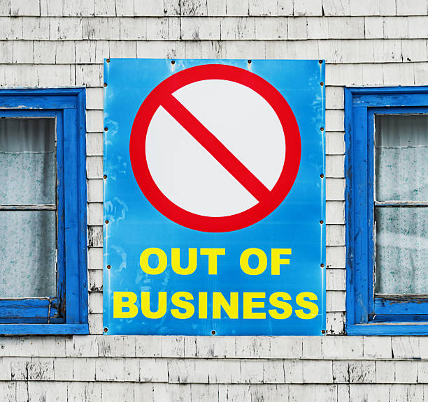 Out of business sign on a tiny seaside shack.