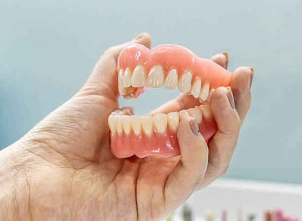 istock Dental Prosthetic Model on a hand. Detailed dental model 2209814019