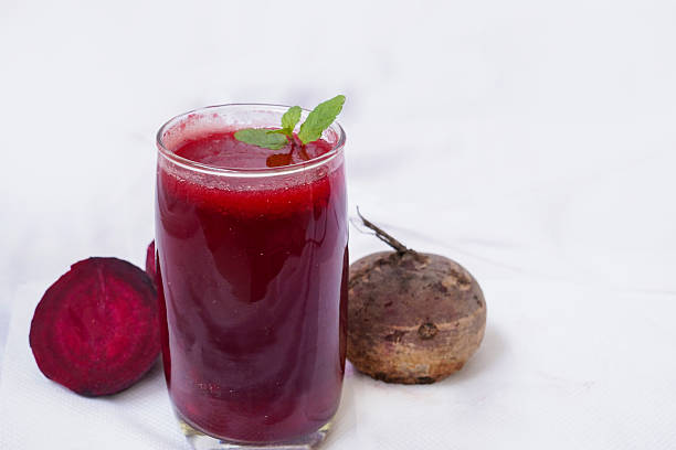istock Smoothies with Beetroot, and mint leaves in glass with fresh vegetables on the white background. Detox, diet, healthy, vegetarian food and drink concept. 2209831464