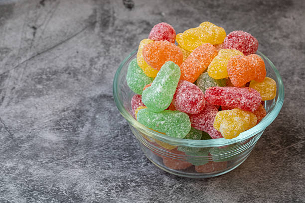 istock Colourful sour candy in a glass bowl. 2209834032