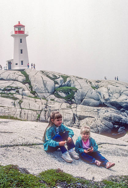 istock Peggy's Cove - Sisters By Lighthouse - 1985 2209834939