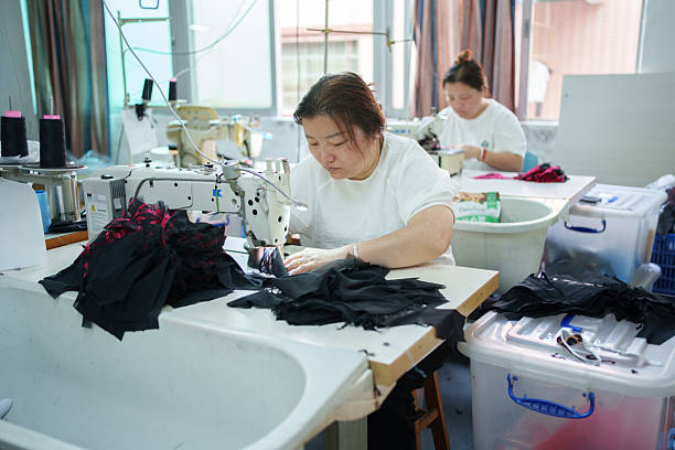 istock Underwear sewing worker in a manufacturing factory 2209835190