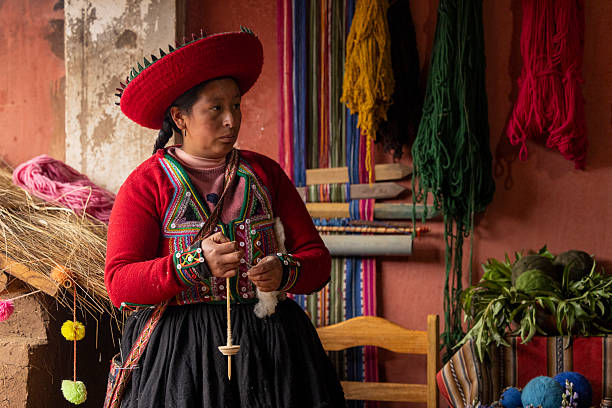 Peru, Cusco-March 15,2025: Local vendors work diligently in Cusco’s main square, selling handmade crafts and textiles