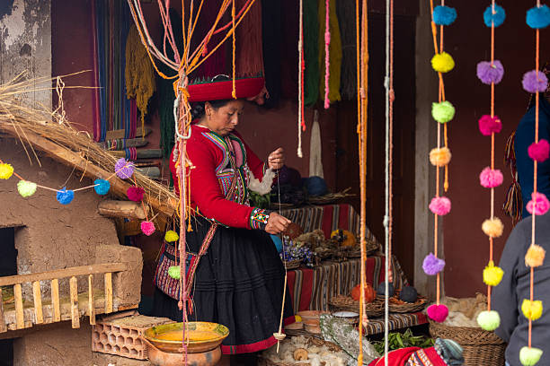 Peru, Cusco-March 15,2025: Local vendors work diligently in Cusco’s main square, selling handmade crafts and textiles