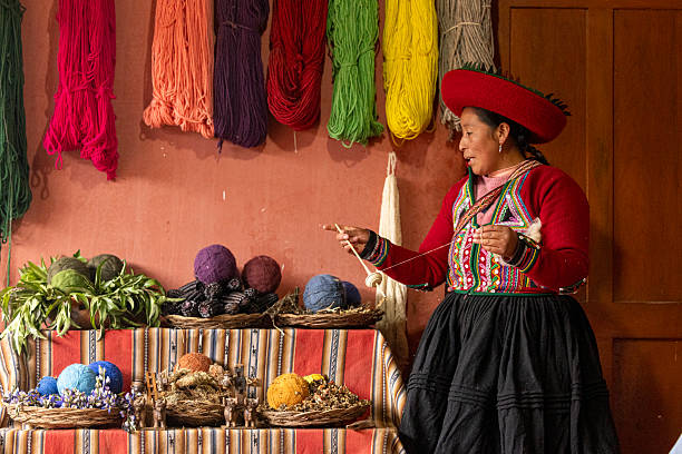 Peru, Cusco-March 15,2025: Local vendors work diligently in Cusco’s main square, selling handmade crafts and textiles