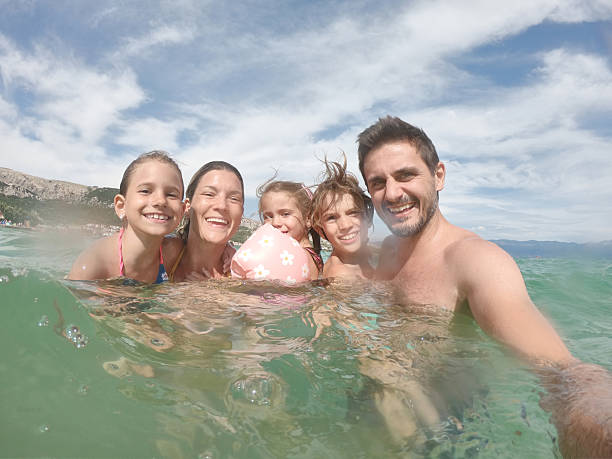 istock Young family enjoying vacation 2209837269