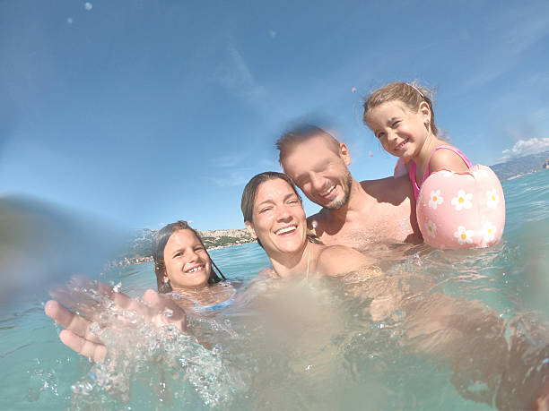 istock Young family enjoying vacation 2209837321