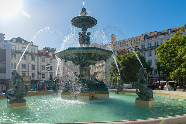 LISBON, PORTUGAL - NOVEMBER 21, 2018: Rossio square with fountain located at Baixa district