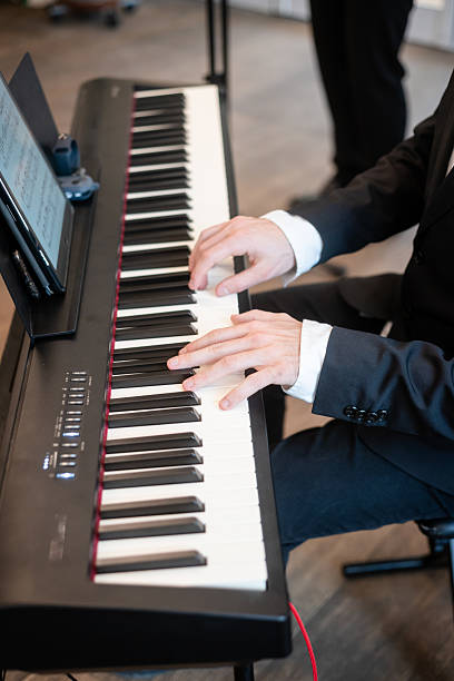 istock Musician plays piano at a formal event indoors 2209841098