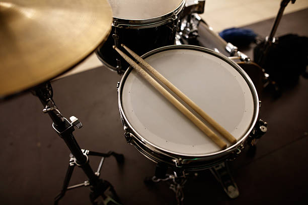 istock A pair of drumsticks are resting on a drum head 2209843159