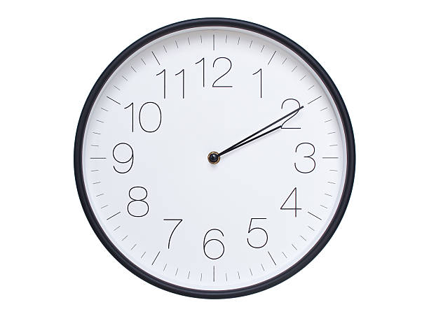 Simple wall clock with black frame and white face displaying 02:10 or 14:10. Ideal for time, schedule, and punctuality themes.