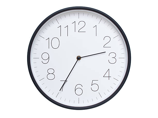 Simple wall clock with black frame and white face displaying 02:35 or 14:35. Ideal for time, schedule, and punctuality themes.
