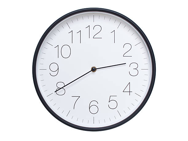 Simple wall clock with black frame and white face displaying 02:40 or 14:40. Ideal for time, schedule, and punctuality themes.