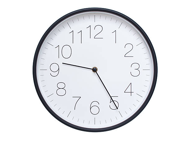 istock Simple wall clock with black frame and white face displaying 09:25 or 21:25. Ideal for time, schedule, and punctuality themes. 2209850600
