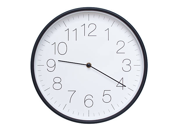 istock Simple wall clock with black frame and white face displaying 09:20 or 21:20. Ideal for time, schedule, and punctuality themes. 2209850606