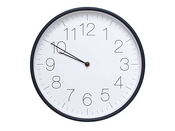 istock Simple wall clock with black frame and white face displaying 09:50 or 21:50. Ideal for time, schedule, and punctuality themes. 2209850624