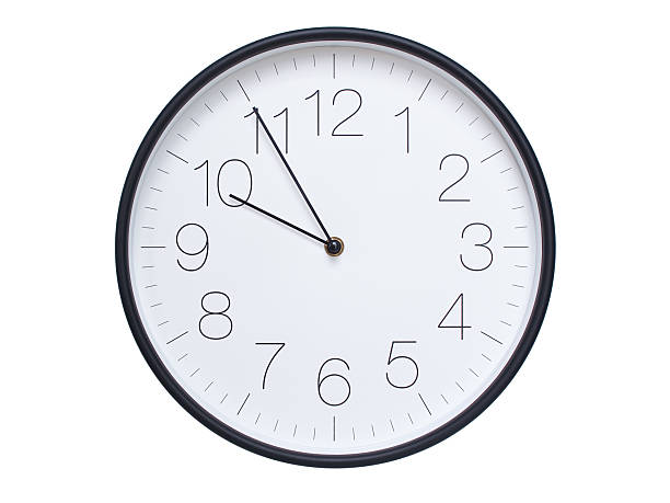 istock Simple wall clock with black frame and white face displaying 09:55 or 21:55. Ideal for time, schedule, and punctuality themes. 2209850626