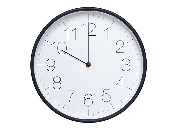 istock Simple wall clock with black frame and white face displaying 10:00 or 22:00. Ideal for time, schedule, and punctuality themes. 2209850628
