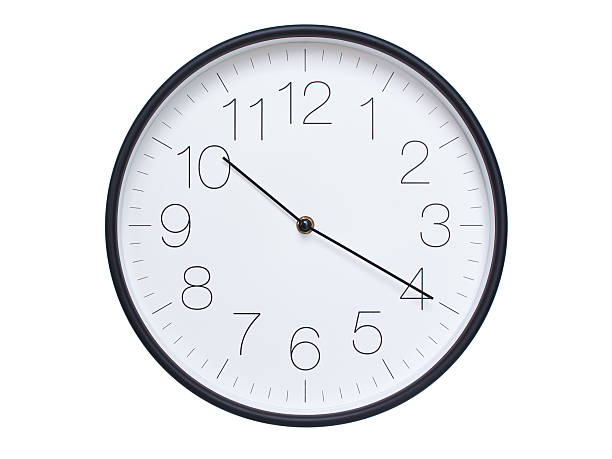istock Simple wall clock with black frame and white face displaying 10:20 or 22:20. Ideal for time, schedule, and punctuality themes. 2209850637
