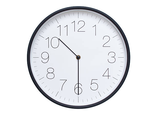 istock Simple wall clock with black frame and white face displaying 10:30 or 22:30. Ideal for time, schedule, and punctuality themes. 2209850643